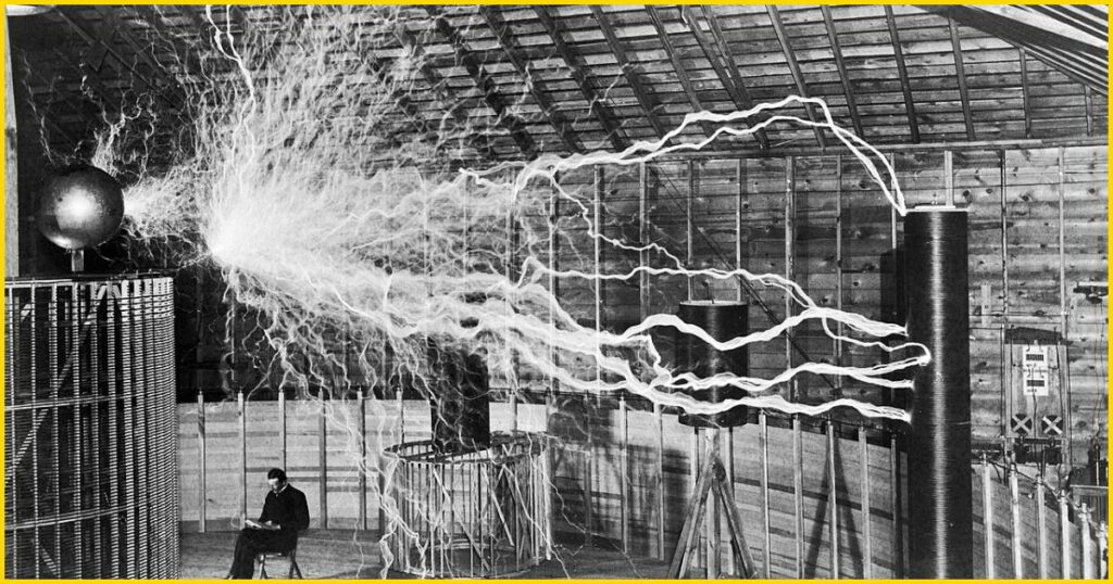Serbian-American inventor Nikola Tesla observes massive artificial lightning bolts generated by his magnifying transmitter in Colorado Springs laboratory, 1899