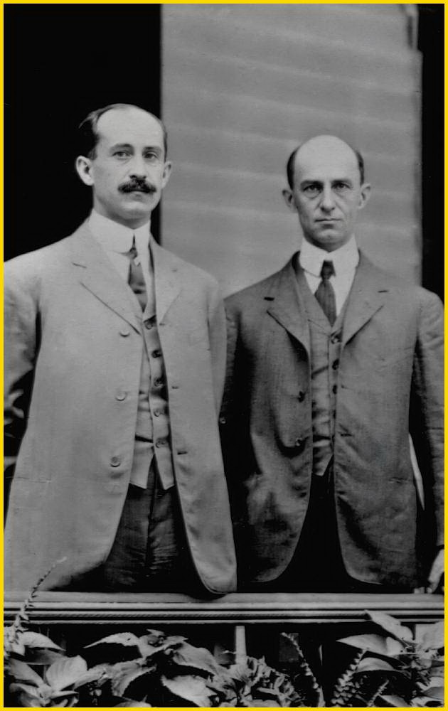 Wilbur and Orville Wright, inventors of the first successful airplane, standing outdoors in Dayton, Ohio, in 1909.